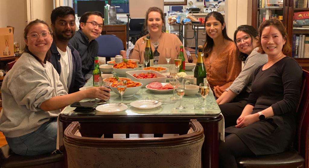 Cecile Licad et al. sitting at a table in a restaurant