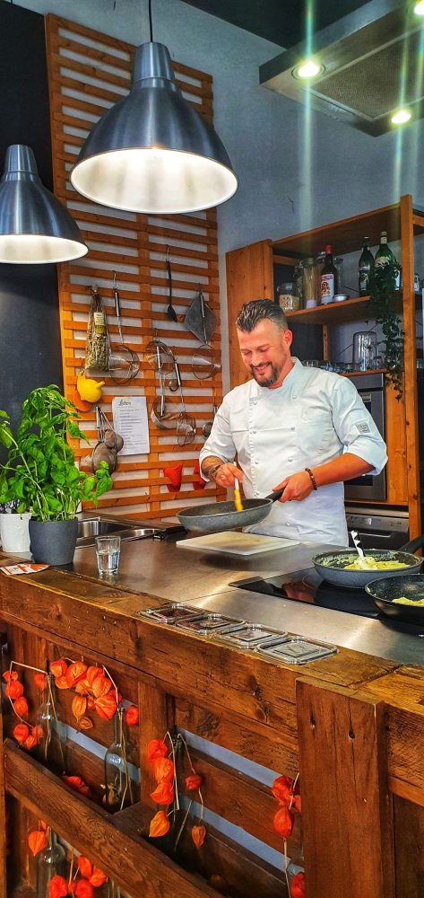 a man cooking food on a table