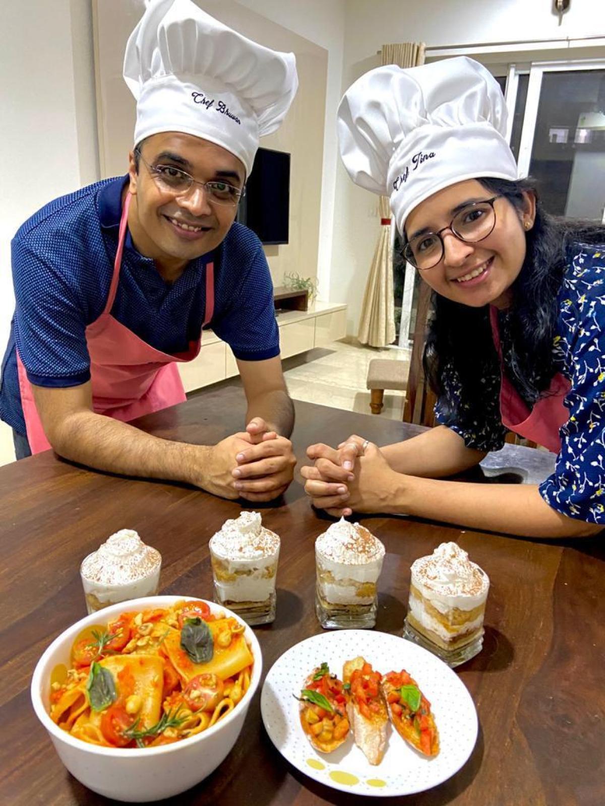 a woman sitting at a table with a plate of food