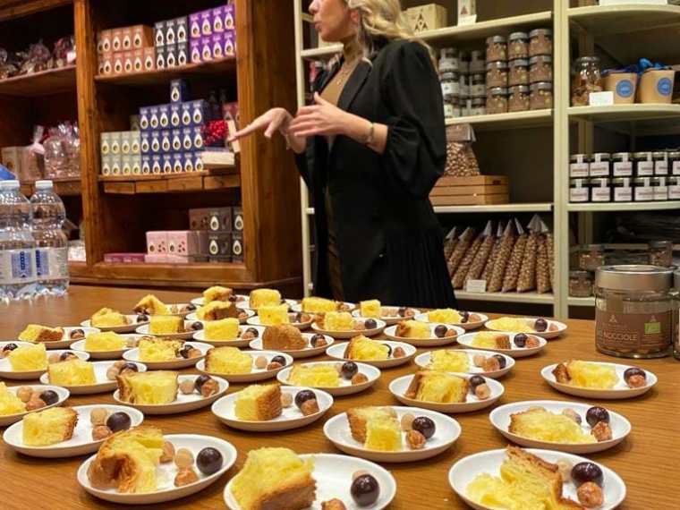 a person sitting at a table full of food