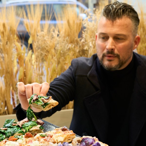 a person sitting at a table with a plate of food