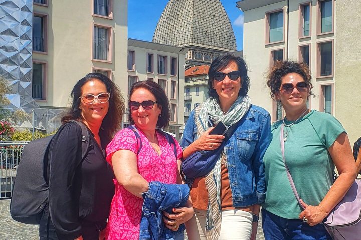 a group of people standing in front of a building