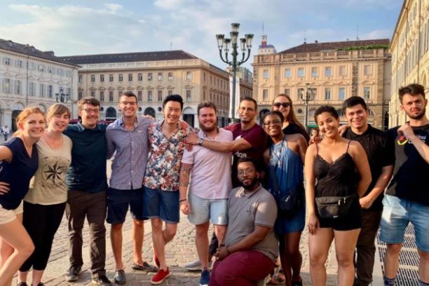 a group of people standing in front of a building