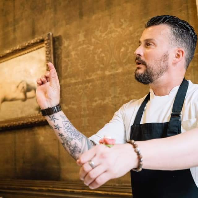 Kevin Honeycutt holding a wine glass