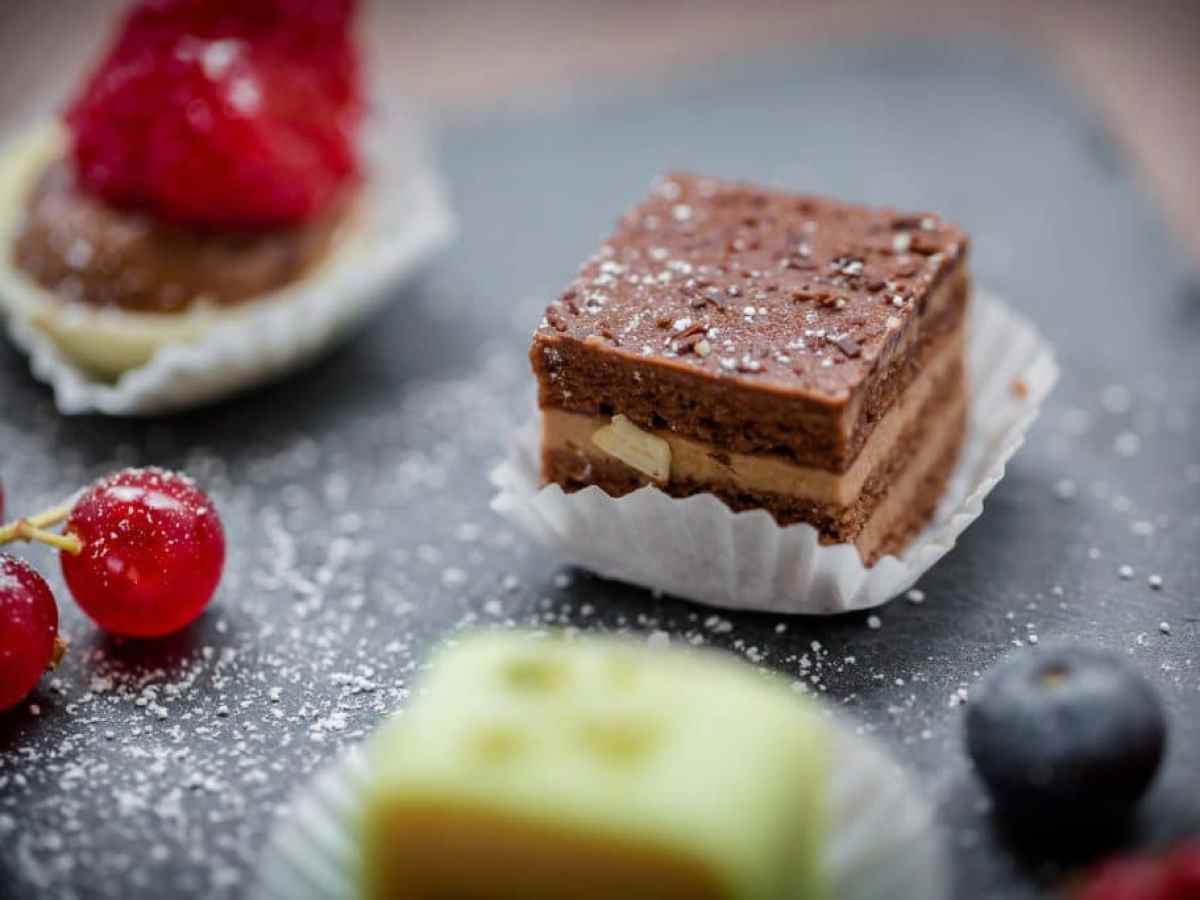 a close up of a piece of chocolate cake on a plate