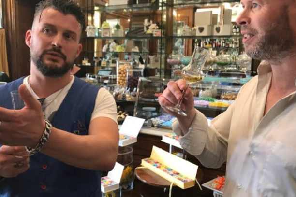 a man standing in front of a store