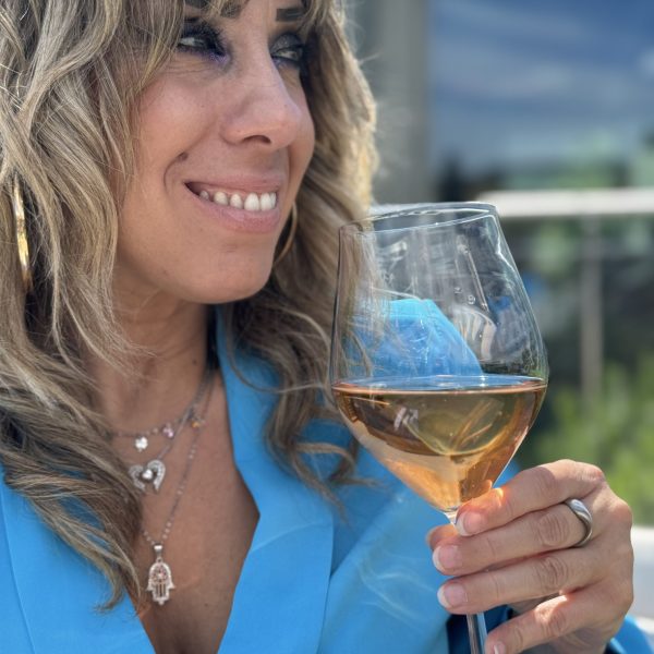 a woman holding a wine glass