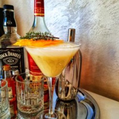 a bottle of wine and a glass of beer on a table