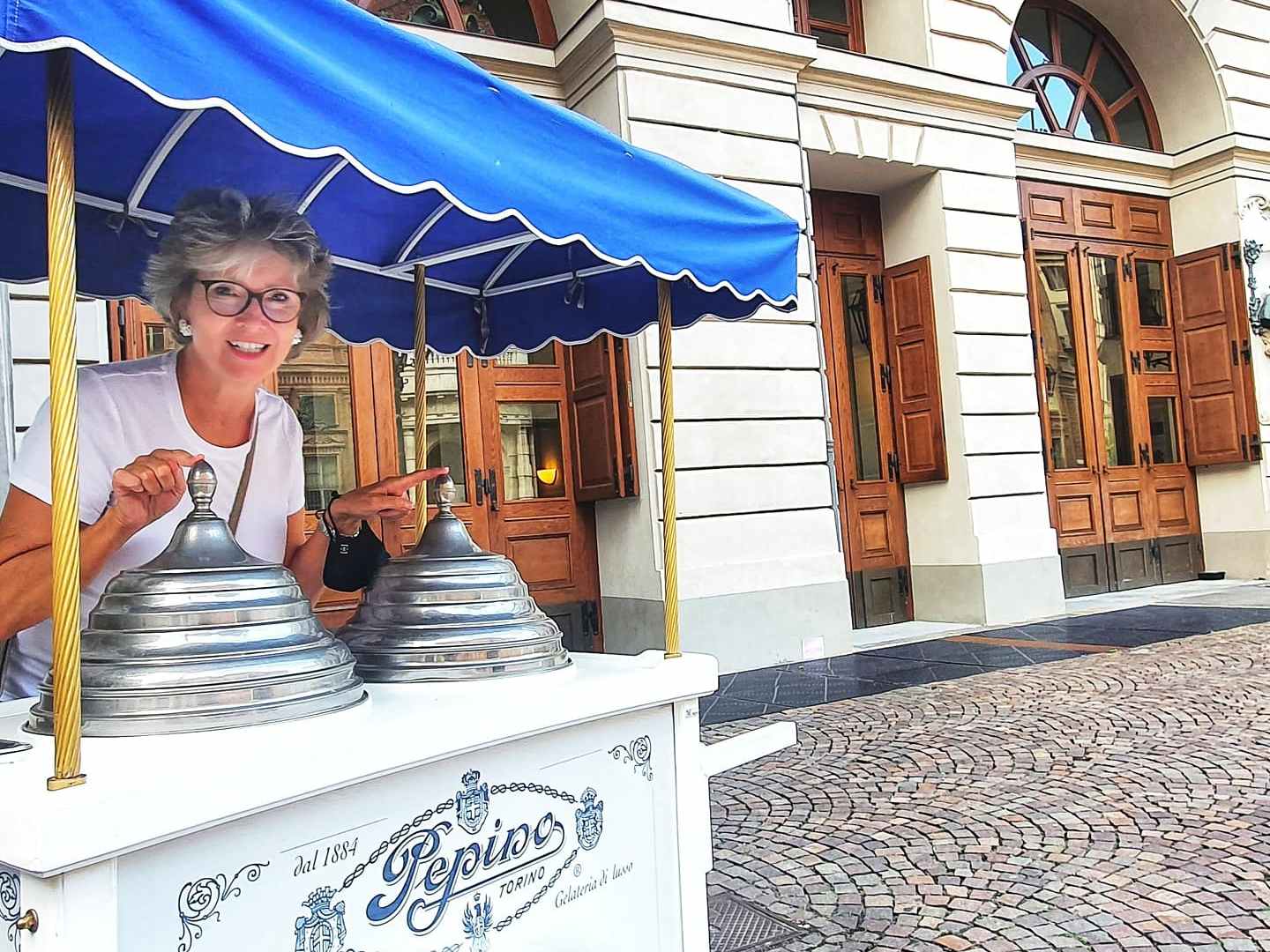 a man standing in front of a building