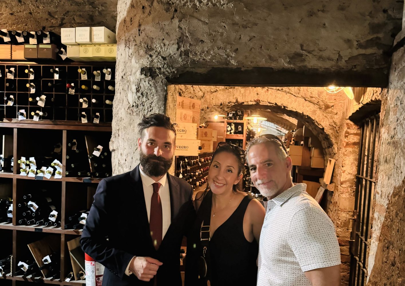 People standing in a wine cellar