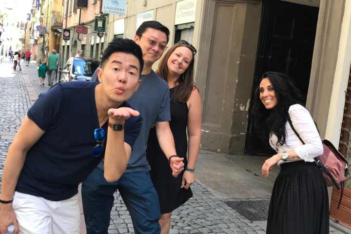 a group of people on a sidewalk