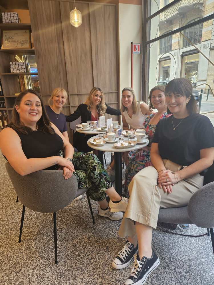 a group of people sitting posing for the camera