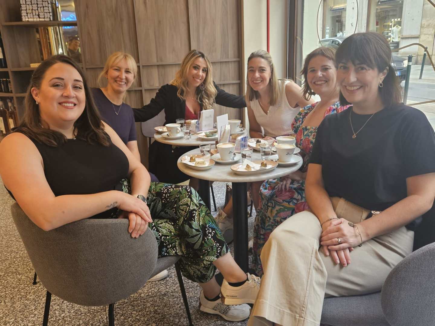 a group of people sitting posing for the camera