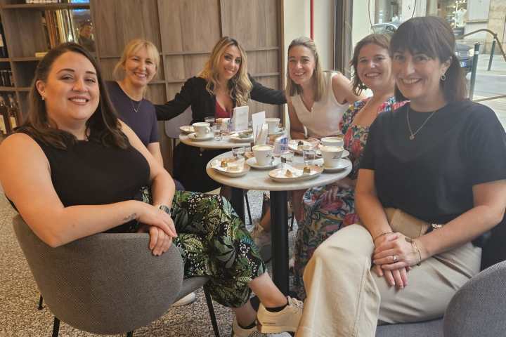 a group of people sitting posing for the camera