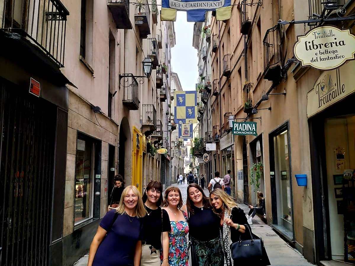 a woman walking down a city street