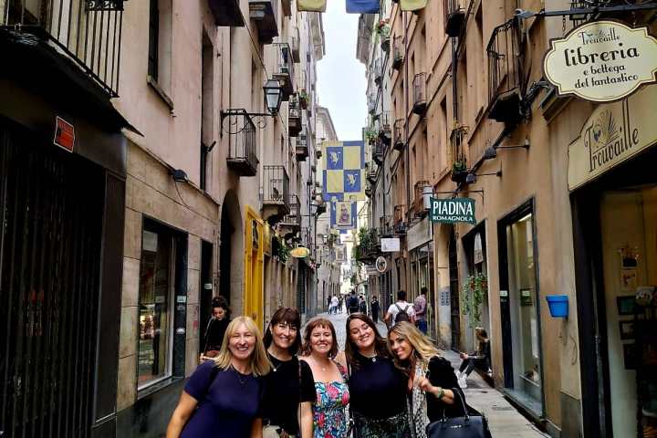 a woman walking down a city street