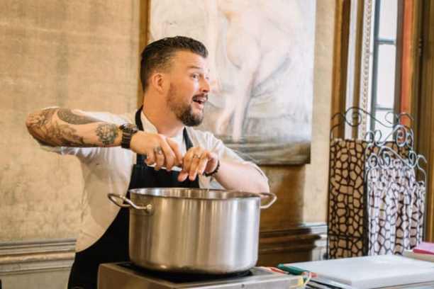a man preparing food in a kitchen