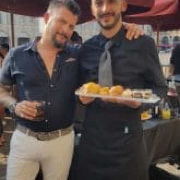 a person holding a hot dog