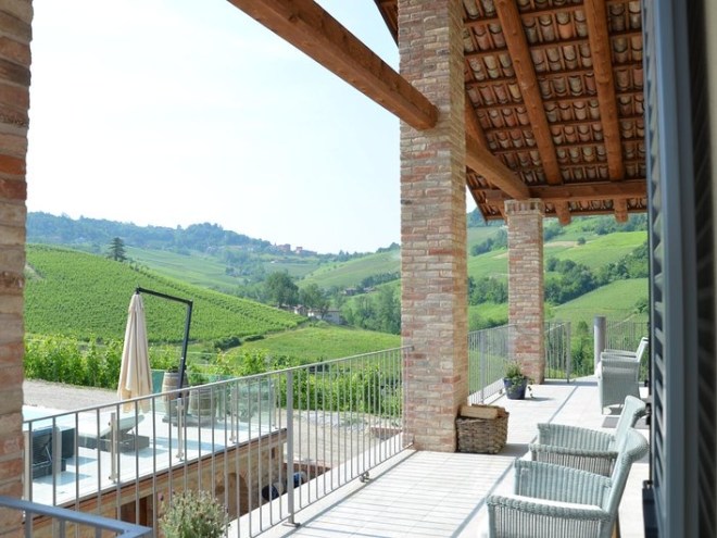 a large brick building with a wooden fence