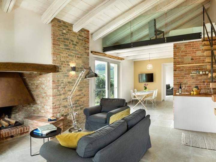 a living room filled with furniture and a fire place