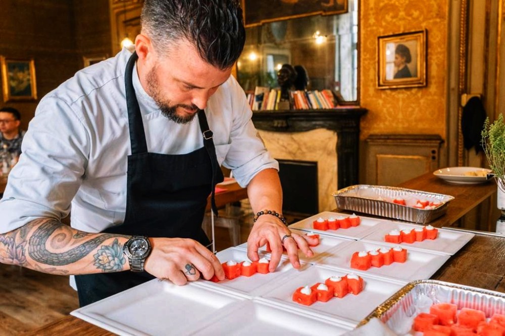 a man cutting food on a table