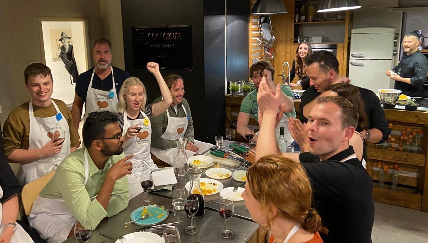 85638D3A-2816-4FB9-A425-766E01833C4F a group of people sitting at a table eating food