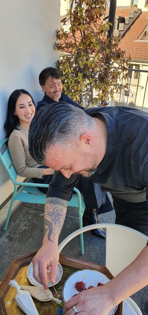 a man and a woman sitting on a table