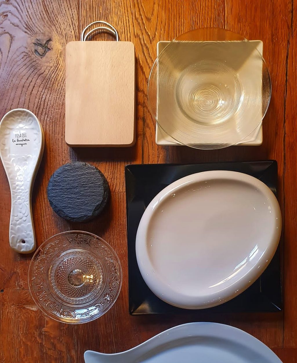 a cup of coffee sitting on top of a wooden table