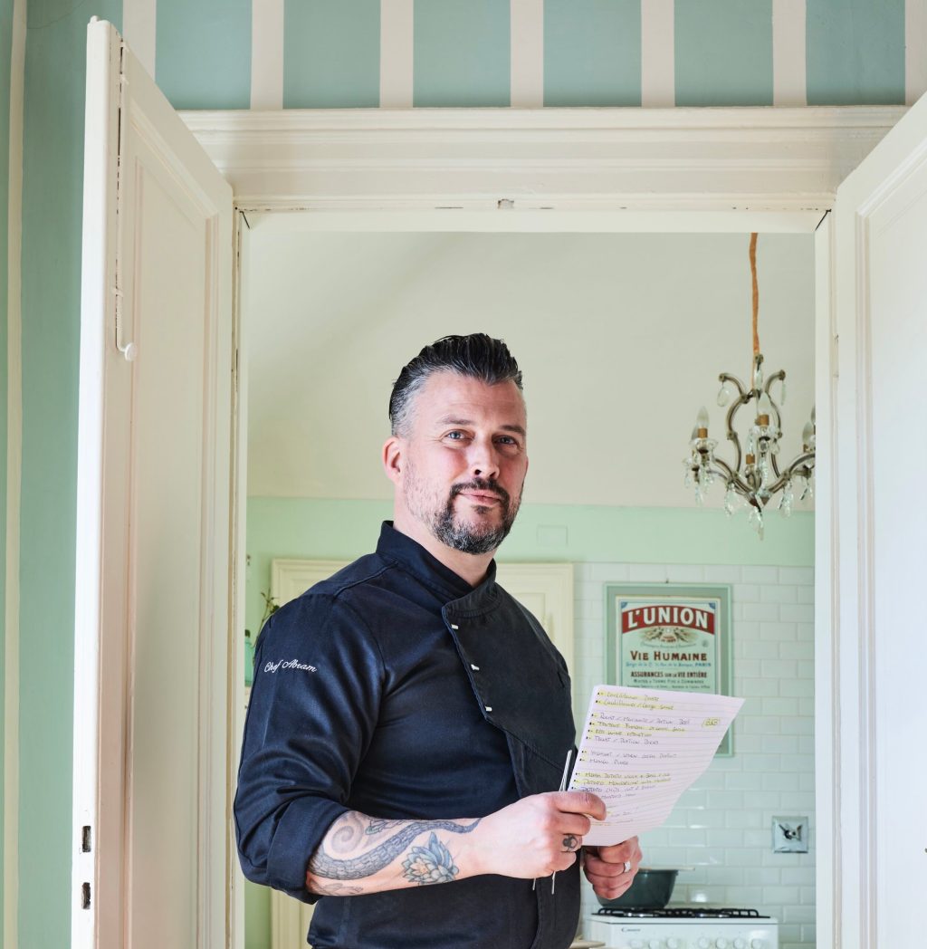 a man standing in front of a window