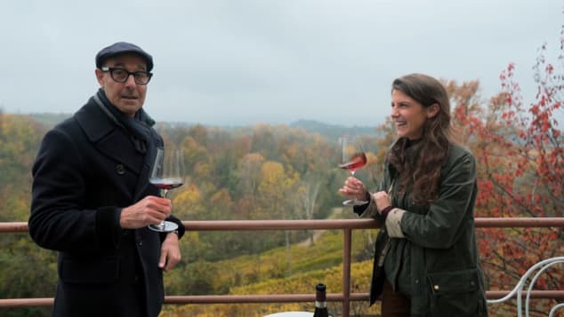 a man and a woman holding a baseball bat