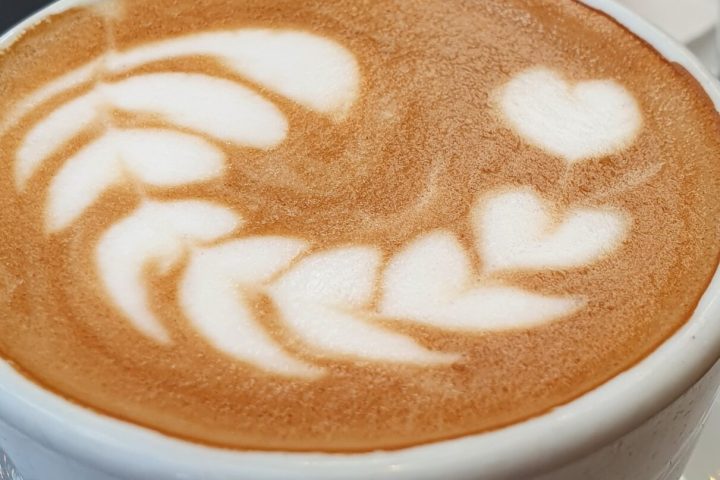 a close up of a coffee cup on a plate