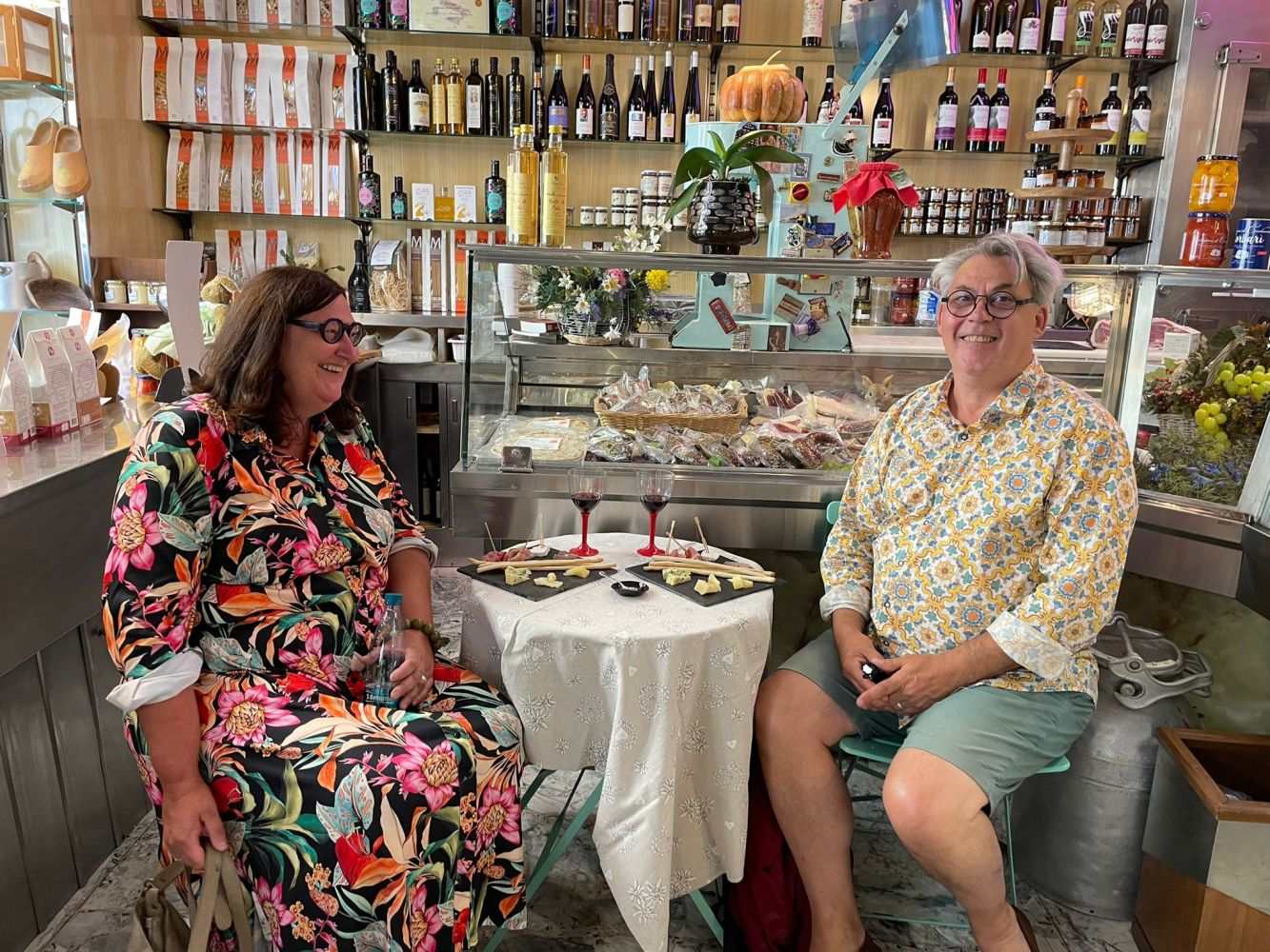 a man and a woman standing in front of a store