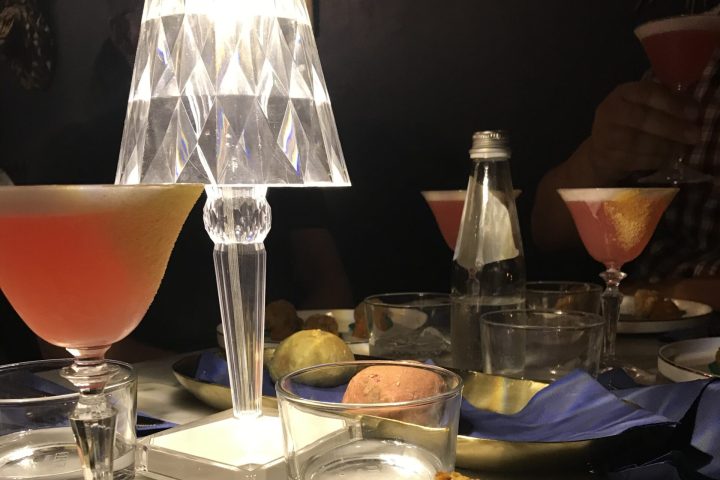 a plate of food and a glass of wine