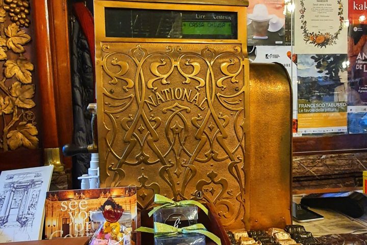 a store filled with lots of furniture and vase on a table