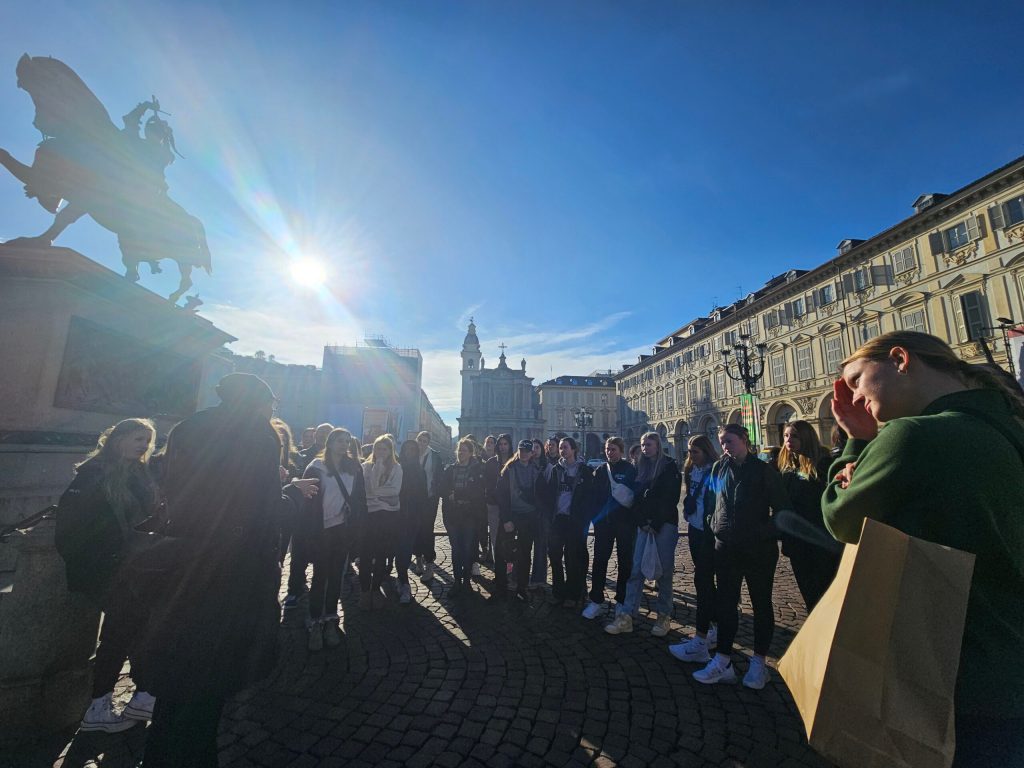 a group of people standing in front of a crowd