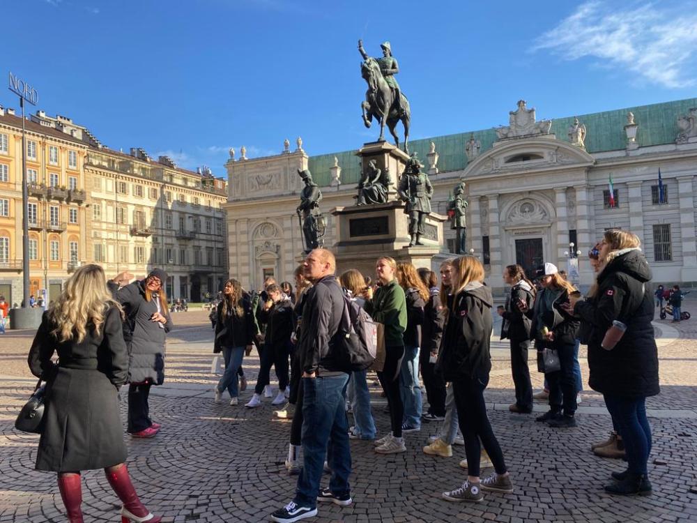a group of people standing in front of a building