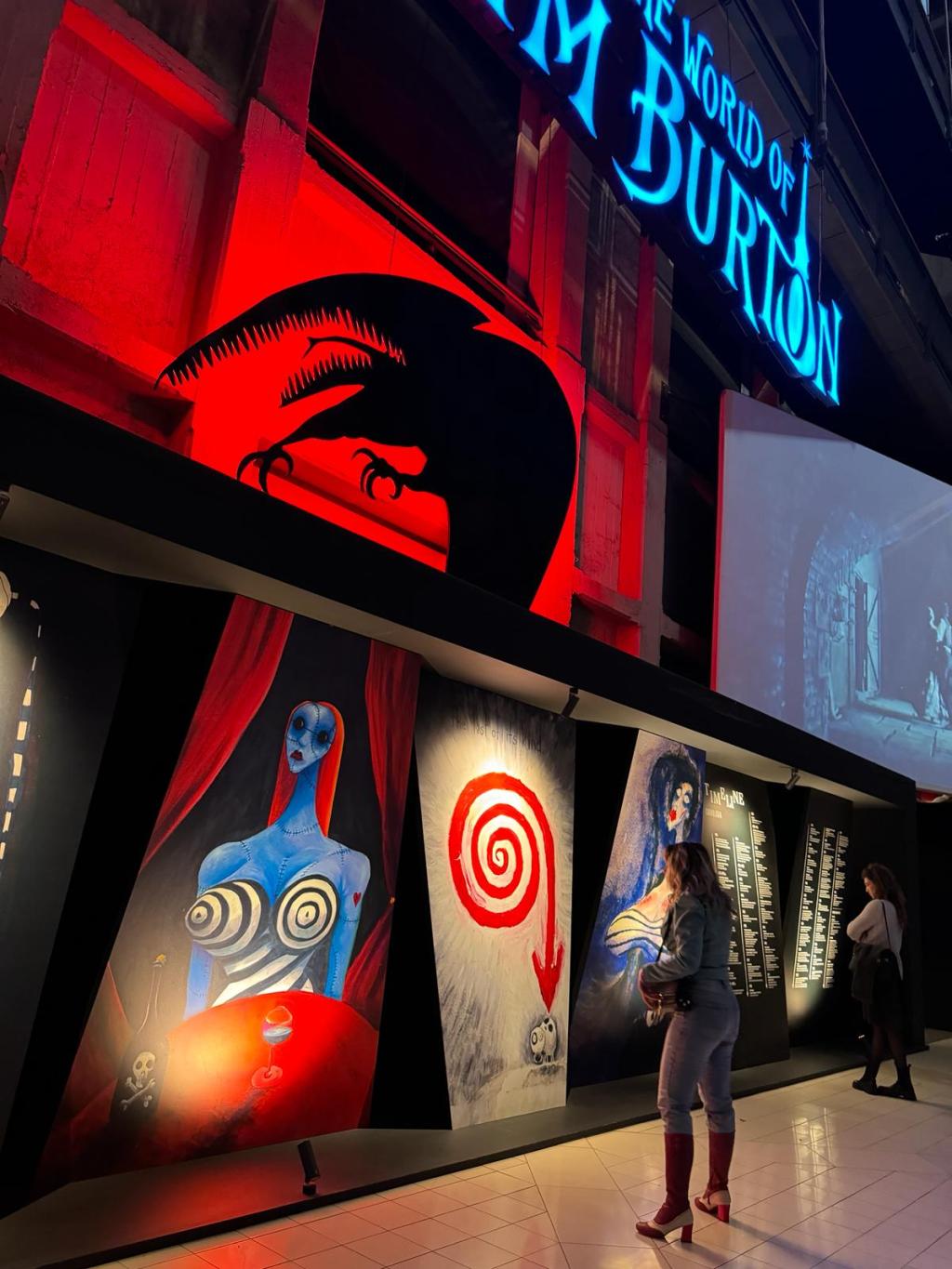 a group of people at a panel of an exibition