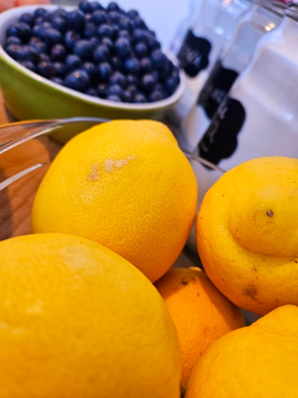 a bowl of oranges on a table
