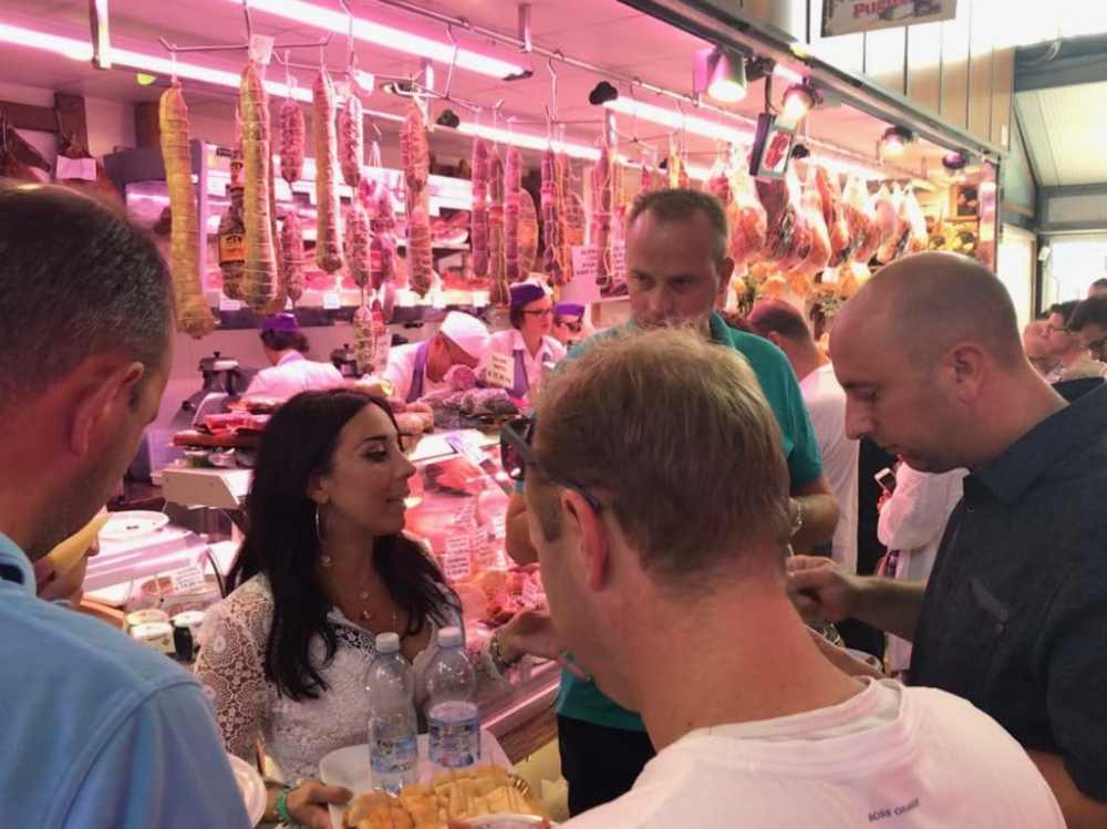 a group of people eating food at a restaurant