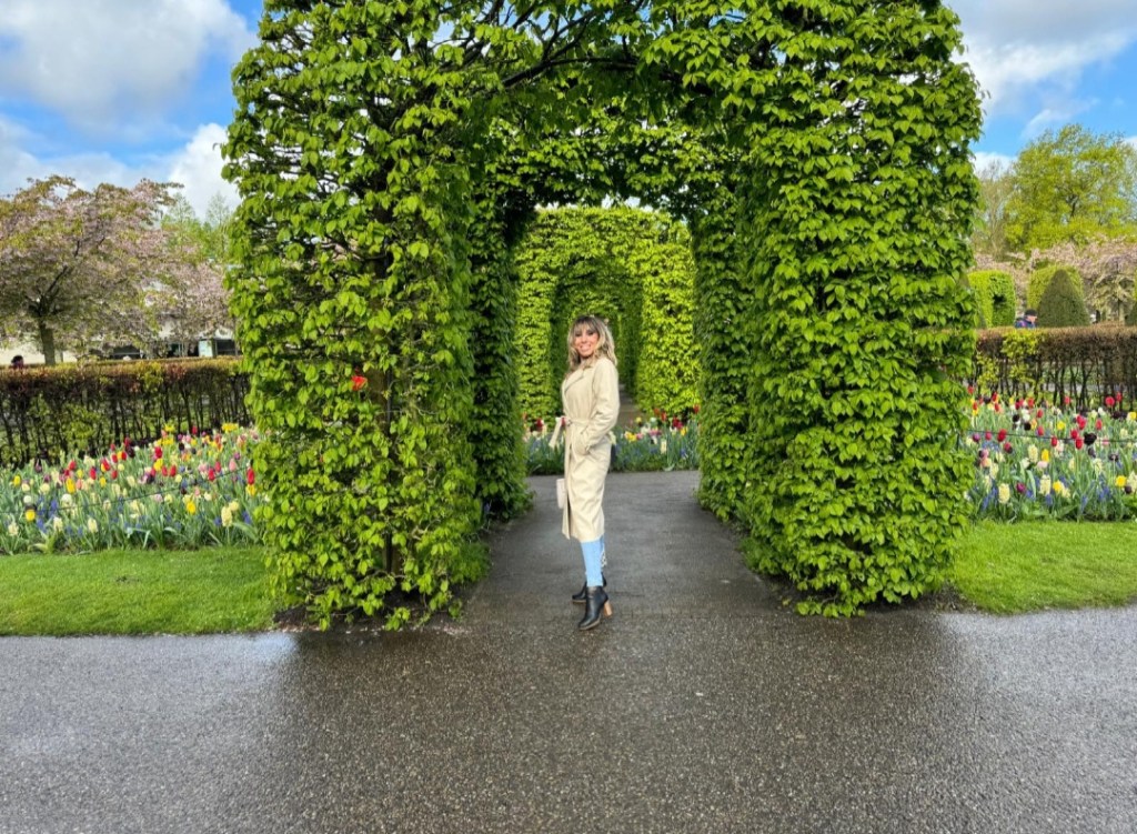 a group of people standing in a garden