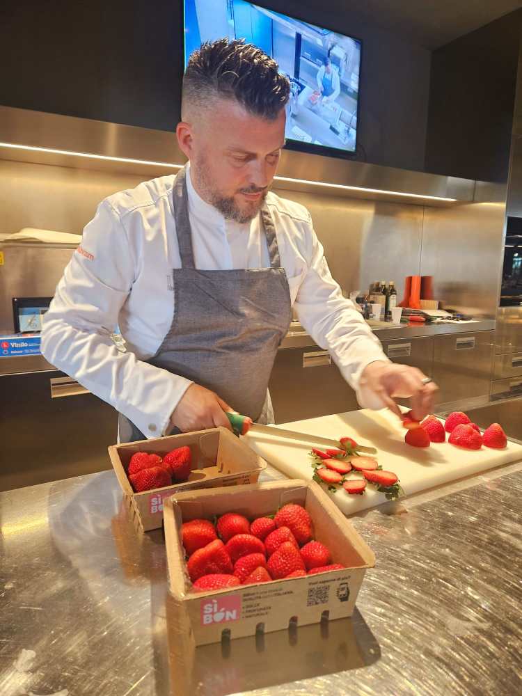 a chef cutting food on a table