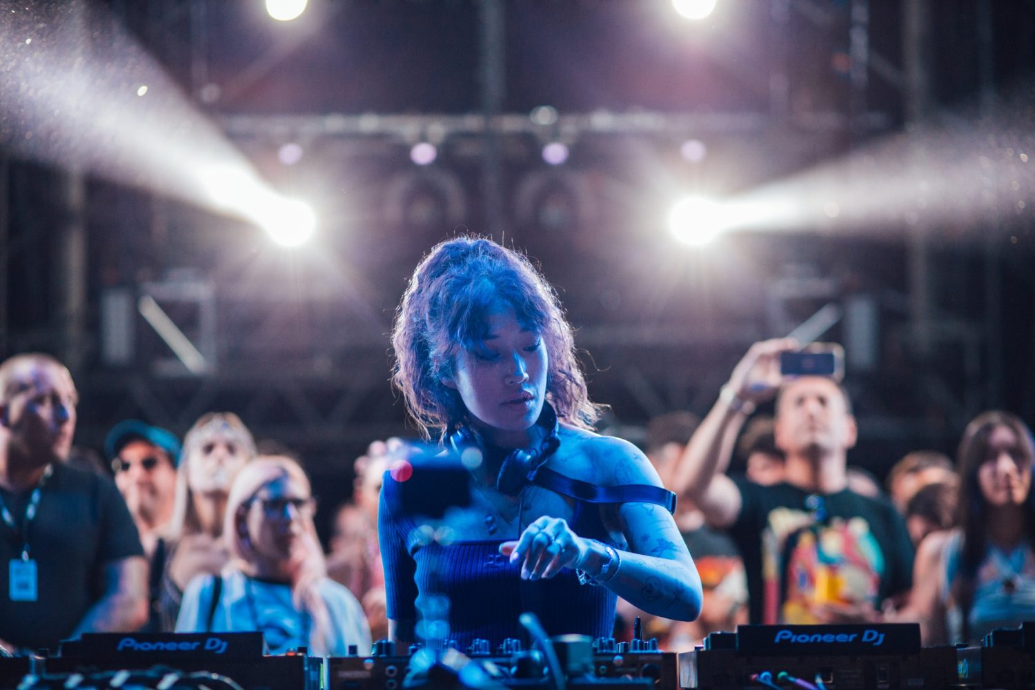 a group of people on a stage in front of a crowd