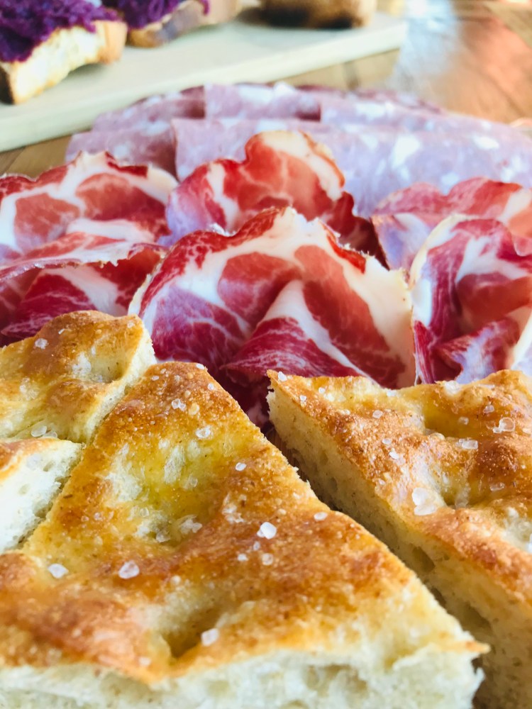 A close up on focaccia and cold cuts