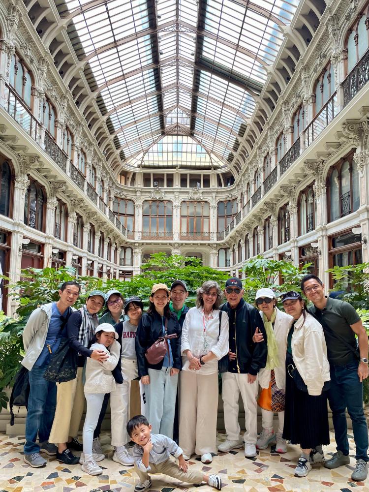 a group of people standing in front of a building