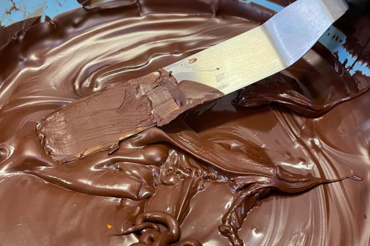 a chocolate cake with a knife and fork