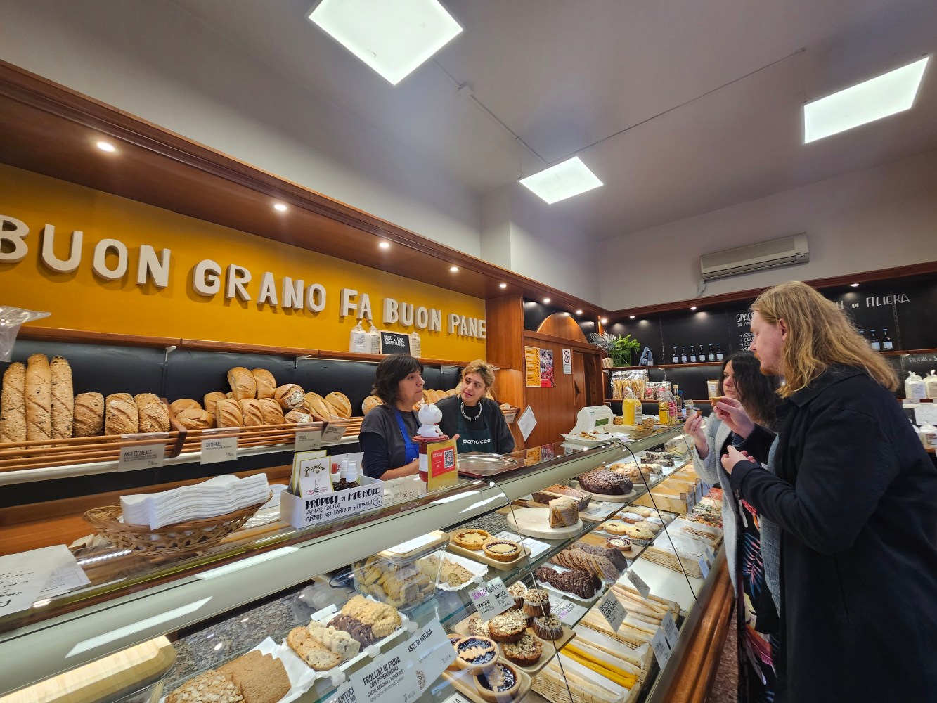 a group of people standing in front of a store