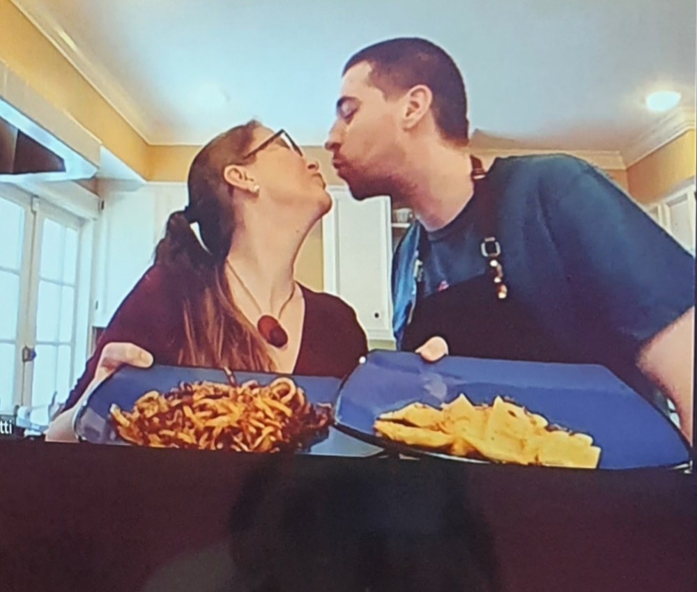 a man and a woman eating food