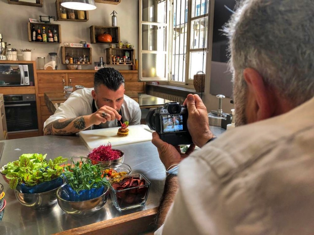 a man sitting at a table with food