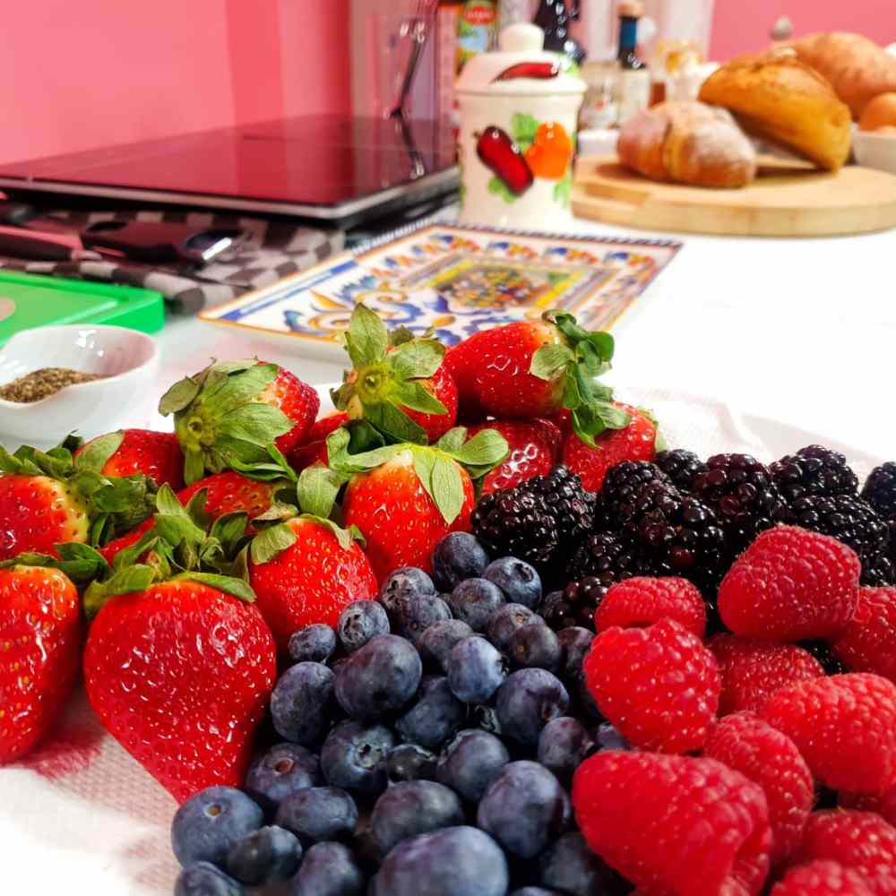 a plate is filled with fresh fruit and vegetables on display