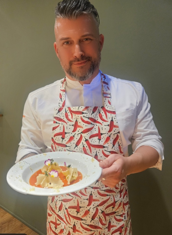 a man holding a plate of food